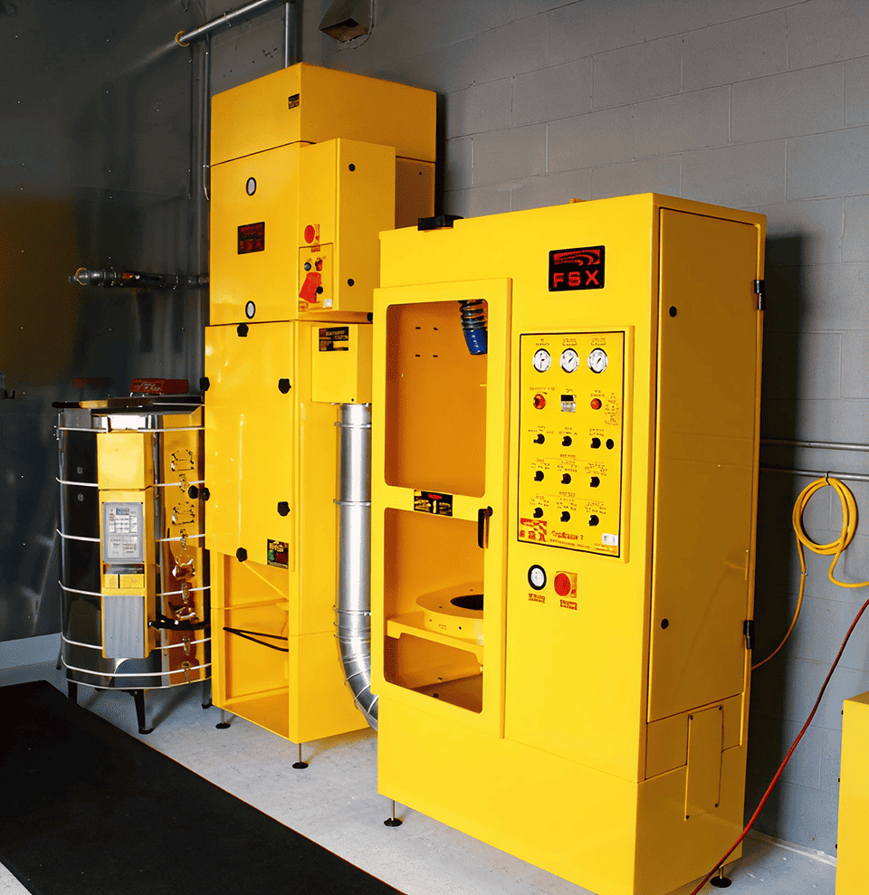 Yellow FSX DPF cleaning equipment in service bay